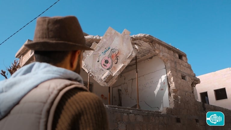 A smile with colors In the rubble of war in Idlib
