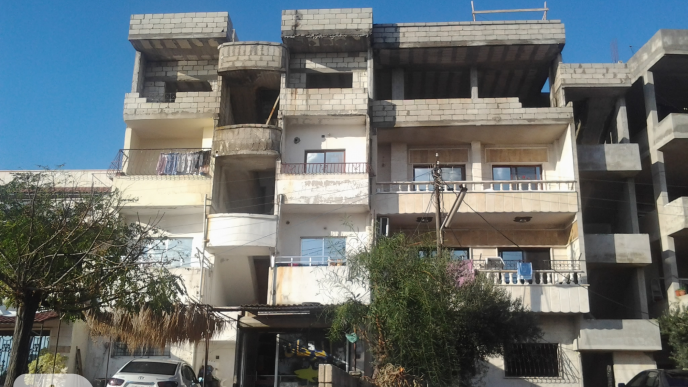 HOW ARE BUILDING CODE VIOLATIONS REMOVED IN LATTAKIA?