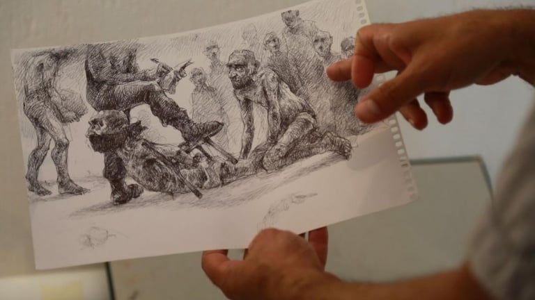 فنّان كاريكاتير سوري يروي معاناته في سجون النظام  بالرسوم