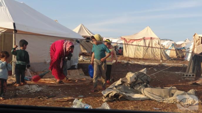 SYRIAN REFUGEES AT ATMA CAMP FIRE THEIR RIFLES IN CELEBRATION!