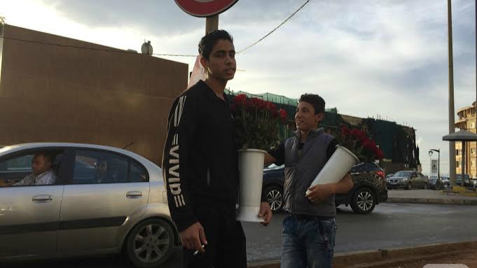 Syrians in the Streets of Beirut Selling Roses and Chewing Gums 