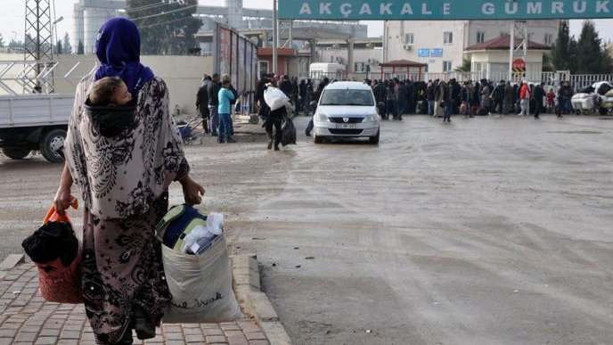 THROUGH THE TAL-ABYAD SYRIAN-TURKISH BORDER CROSSING, ِA SYRIAN REFUGEE RETURNS TO RAQQA