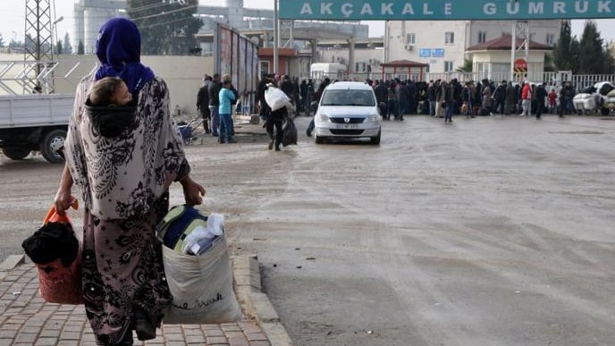 THROUGH THE TAL-ABYAD SYRIAN-TURKISH BORDER CROSSING, ِA SYRIAN REFUGEE RETURNS TO RAQQA