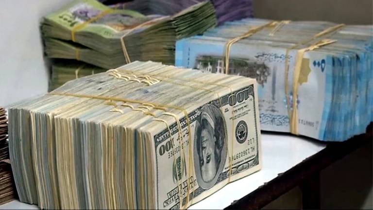 خبيران اقتصاديان: هذه أسباب عدم استقرار سعر صرف الليرة السورية