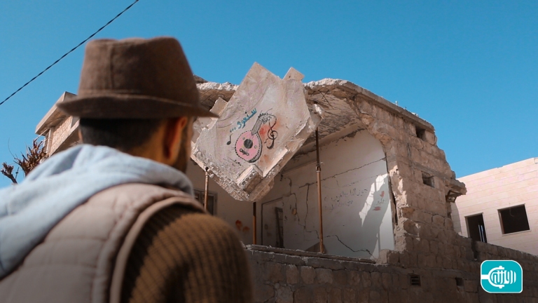 A smile with colors In the rubble of war in Idlib