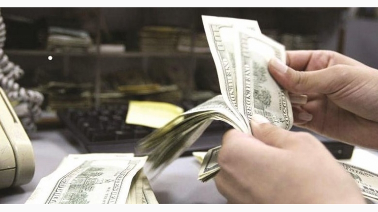  Who profits from dollars in Syria?